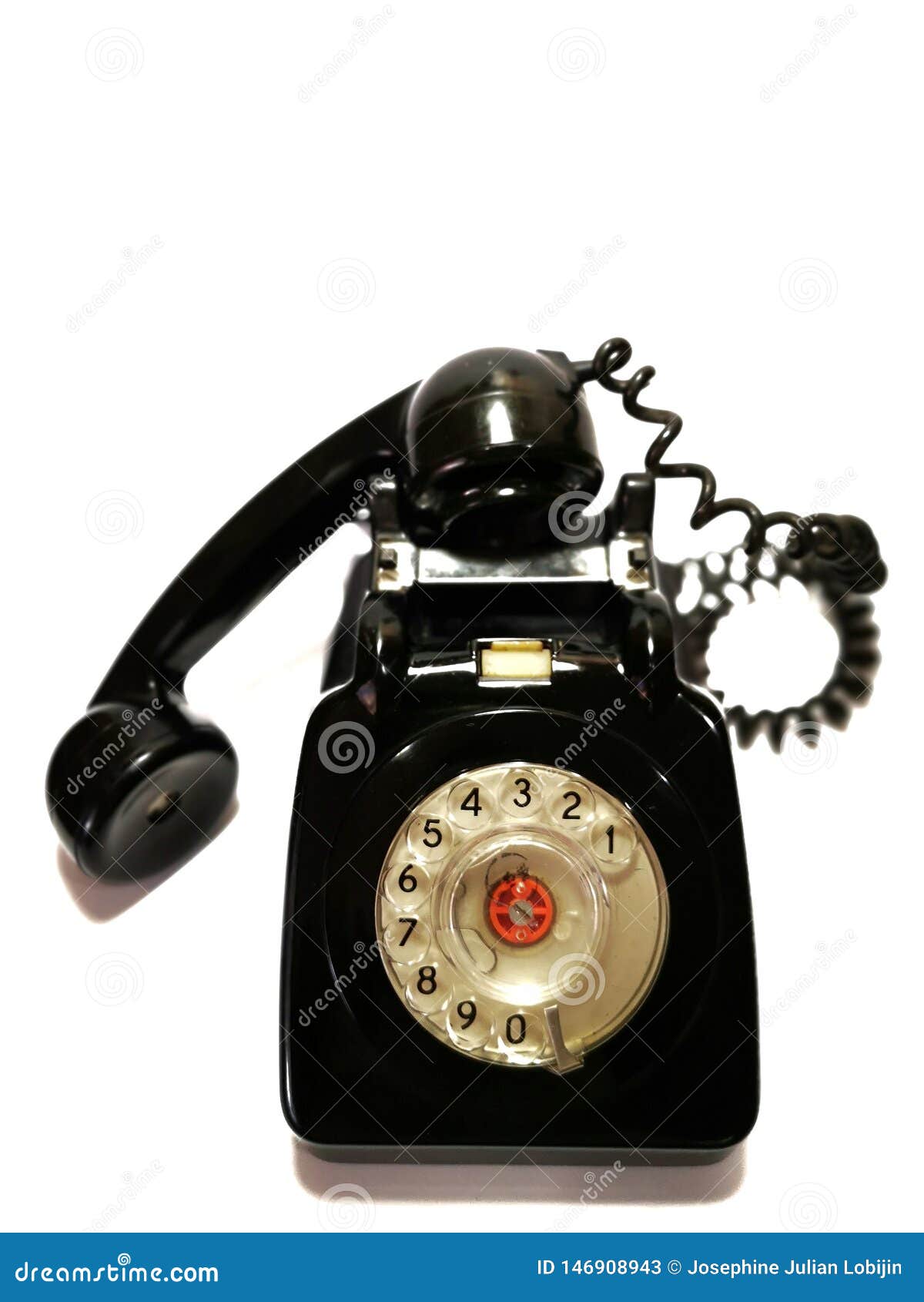 a vintage and antique telephone with white background.